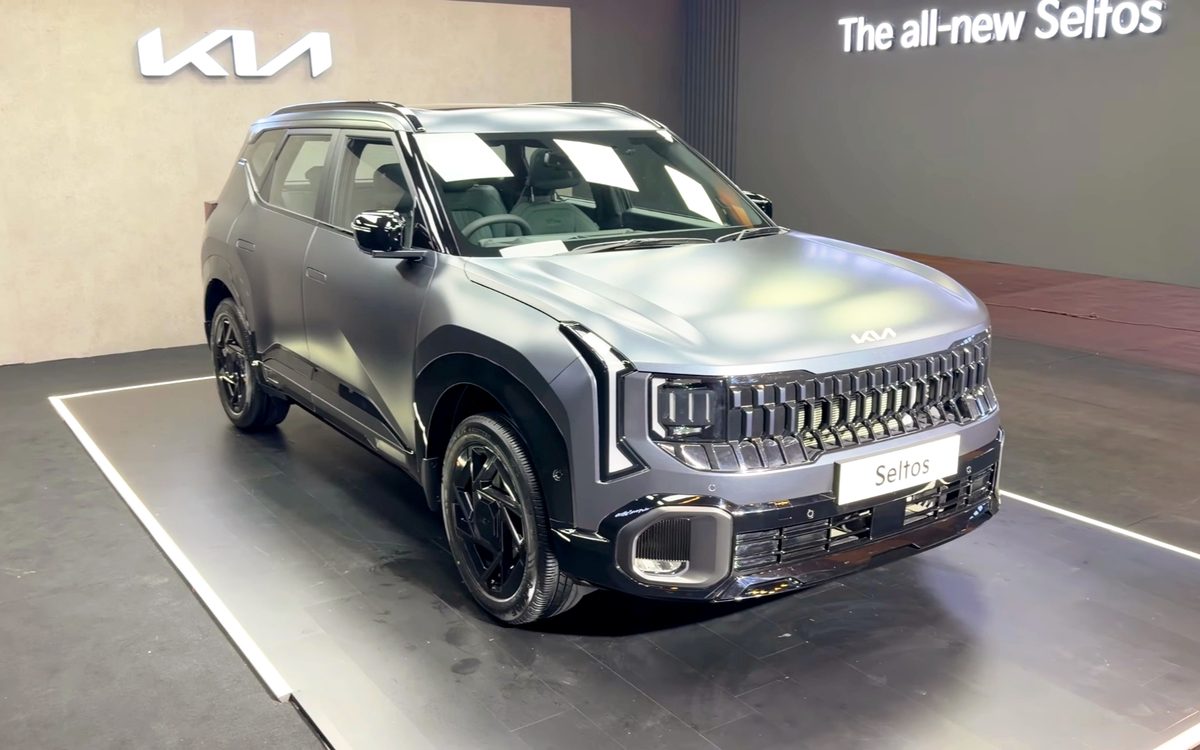 Kia Seltos on display with the Kia logo